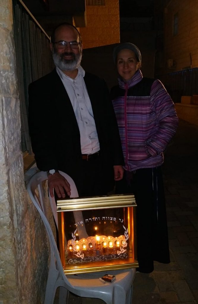 Rav Shalom Miller and Batya Miller celebrating Chanukah in the Old City of Jerusalem